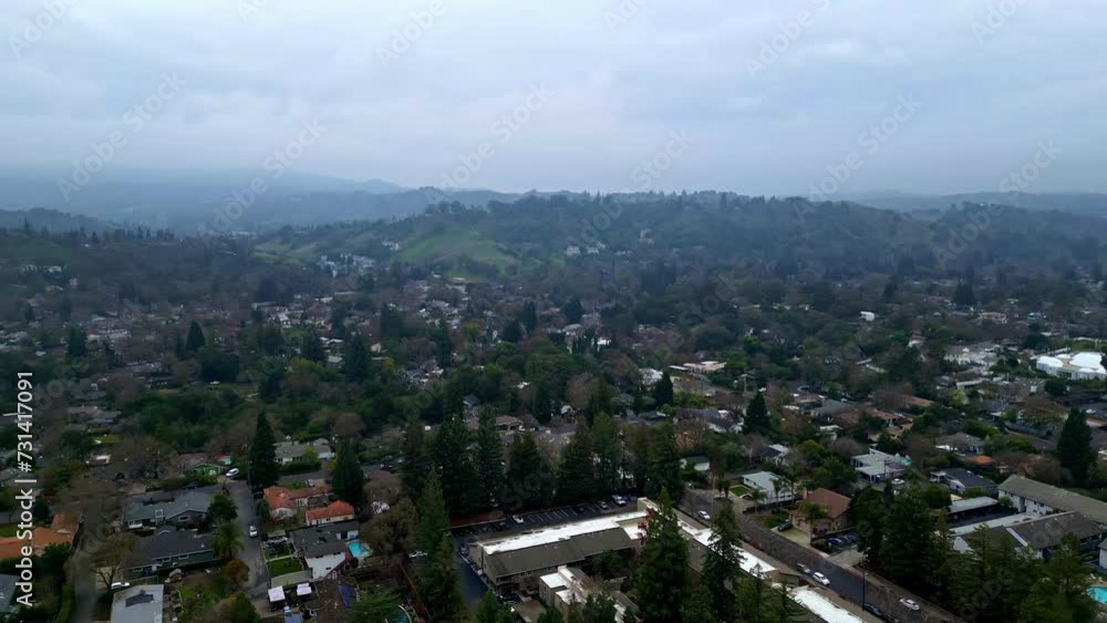 Aerial drone forward moving shot over posh residential bungalows in Walnut Creek, California, USA on a cloudy day. Aerial drone forward moving shot over posh residential bungalows in Walnut Creek, California, USA on a cloudy day.