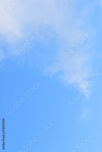 beautiful blue sky and white fluffy group of clouds with sunrise in the morning  natural background