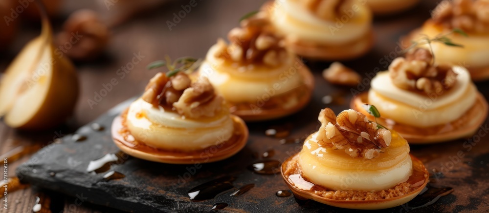 A close up of a dish with nuts on top, featuring a mouthwatering combination of ingredients. This delectable food is a perfect addition to any cuisine or dessert recipe! A close up of a dish with nuts on top, featuring a mouthwatering combination of ingredients. This delectable food is a perfect addition to any cuisine or dessert recipe!