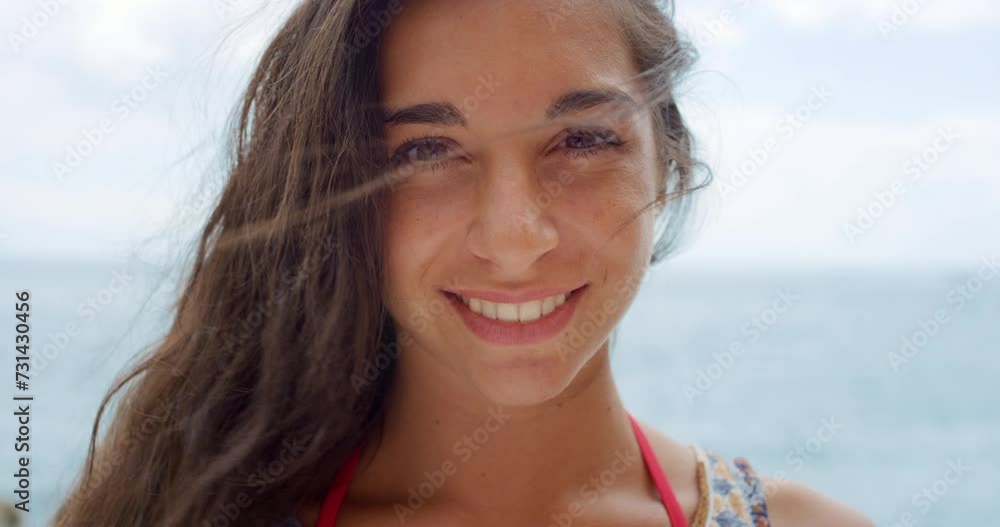 Woman, face and closeup by ocean in nature, happy and healthy on holiday adventure with hair blowing in wind. Person, relax and wellness in portrait on beach, smile and vacation in hawaii in summer Woman, face and closeup by ocean in nature, happy and healthy on holiday adventure with hair blowing in wind. Person, relax and wellness in portrait on beach, smile and vacation in hawaii in summer