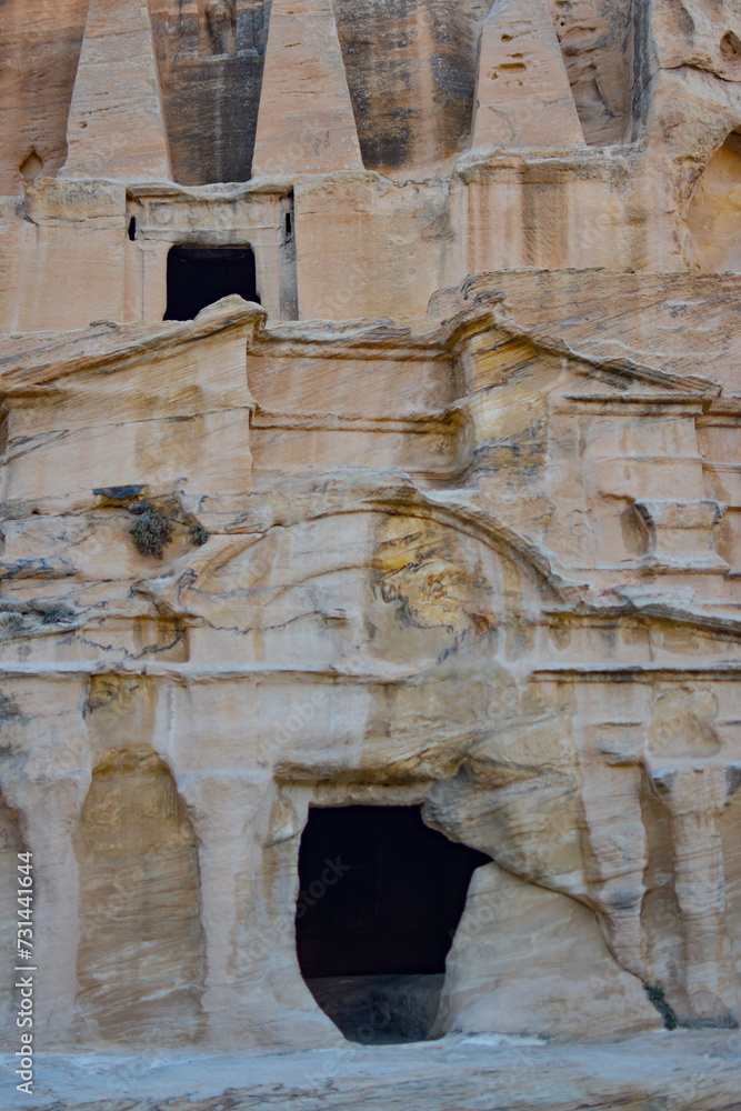 Entrance to a tomb carved into the rock in the Hegra archaeological park of the city of Petra, Wadi Musa, Jordan.