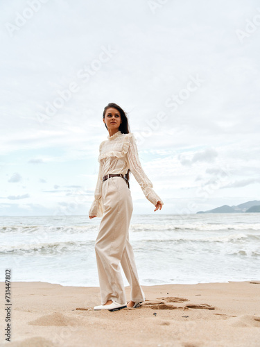 Beauty in the Summer Breeze: A Young Asian Lady Embracing Freedom and Happiness on a Beach in Thailand