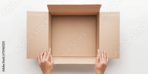 Hands Presenting Open Box © DailyStock