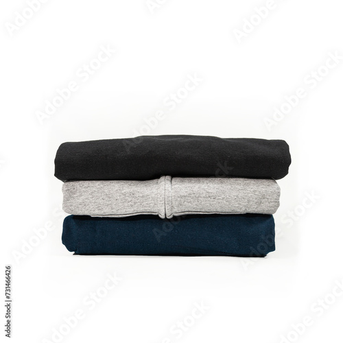 pile of blue back and gray hoodies isolated on white