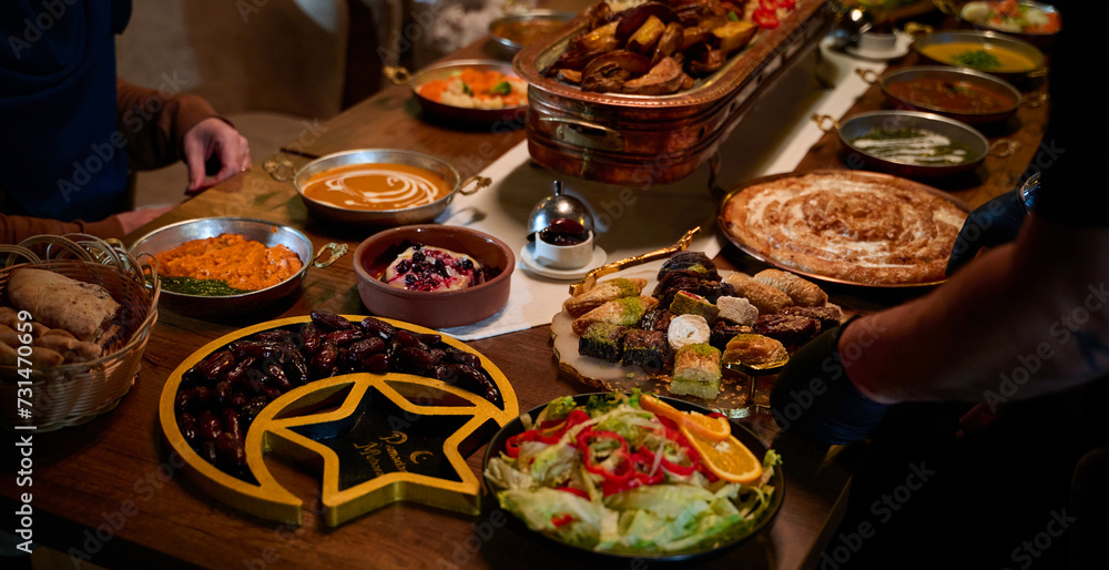 In this captivating aerial view, delicious food adorned with Ramadan decorations, including dates and meat, awaits the arrival of an European Islamic family, promising a festive and flavorful iftar In this captivating aerial view, delicious food adorned with Ramadan decorations, including dates and meat, awaits the arrival of an European Islamic family, promising a festive and flavorful iftar