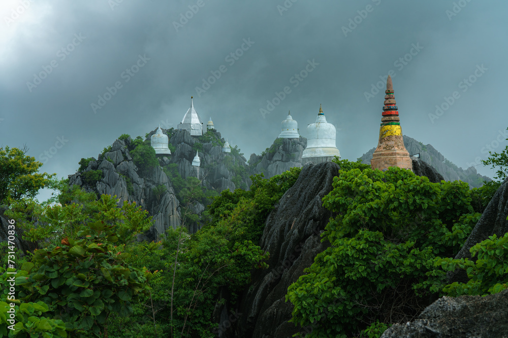Chaloem Phra Kiat Temple amidst Fog: Buddhist temple shrouded in mist, blending architecture, religion, and serene landscapes, evoking history and spirituality