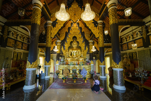 church or cathedral, featuring intricate architecture, religious symbols like Buddha statue, and vibrant stained