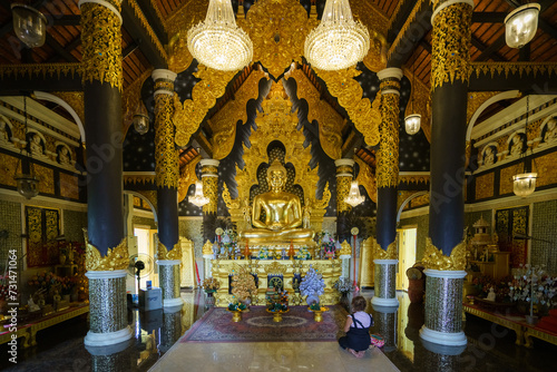 church or cathedral, featuring intricate architecture, religious symbols like Buddha statue, and vibrant stained