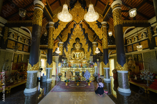 church or cathedral, featuring intricate architecture, religious symbols like Buddha statue, and vibrant stained