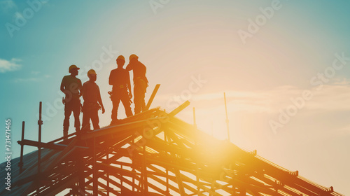 Silhouette of Construction Workers on Roof at Sunset, Teamwork in Building Commercial Structure, Roofers Working Together Against Sky, Construction Industry Professionals on Job