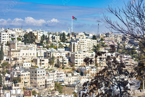 View of the city of Amman with the Jordanian flag in the center, Amman, Jordan.