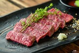 A mouthwatering piece of steak served on a plate with a fresh garnish, A carefully sliced Japanese Matsusaka beef steak, AI Generated