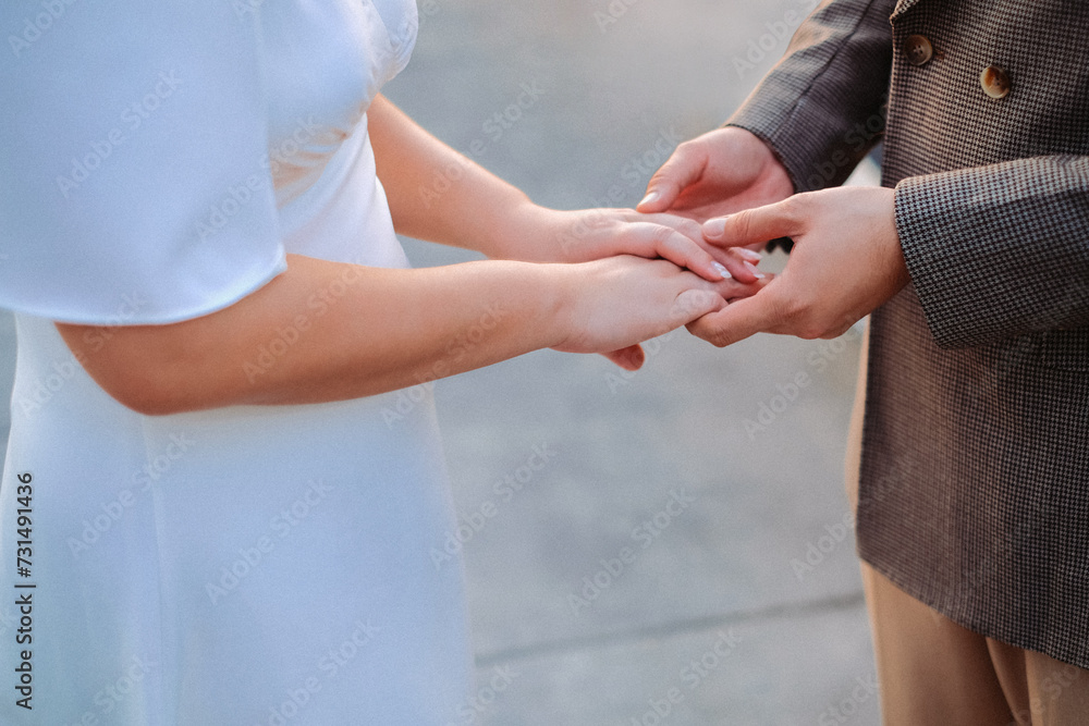bride and groom holding hands was promised. bride and groom holding hands was promised.