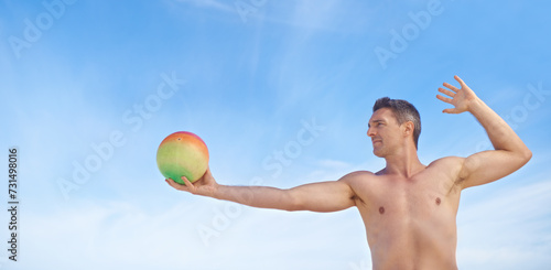 Beach, volleyball and man with fitness, summer and weekend break with recreation and activity. Person, athlete and guy with fun and playing with workout and hobby for wellness, sunshine or healthy © Mapodile M./peopleimages.com