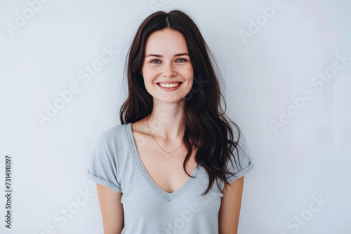 Close up portrait of a happy young woman isolated from a white background copy space for text. © JuanM