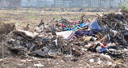 BANGKOK, THAILAND - February 15, 2024: Garbage pile on empty land To prepare to make it an agricultural area. Concept pollution problems in Thailand.