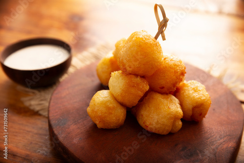 Fried breaded cheese balls, easy and delicious homemade snack recipe. Served with dipping sauce.