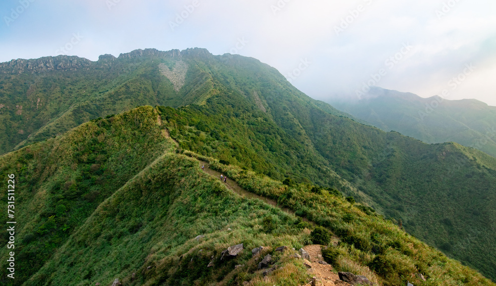 Small trails on the mountain ridge leads to the high peak with heart-shape rocks in Jinguashi, New Taipei City, Taiwan.