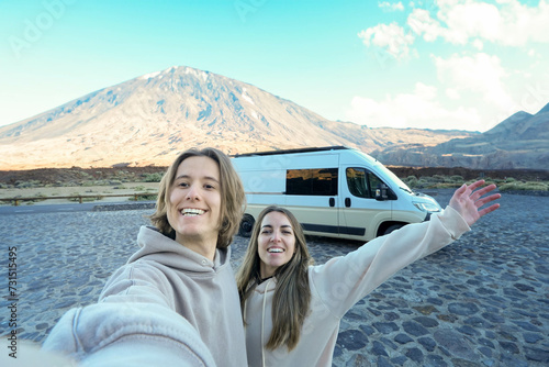 Happy Couple Taking a Selfie With Their Van at Teide Mountain
