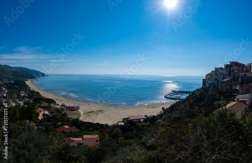 View on sandy beach from hilly medieval small touristic coastal town Sperlonga and sea shore, Latina, Italy