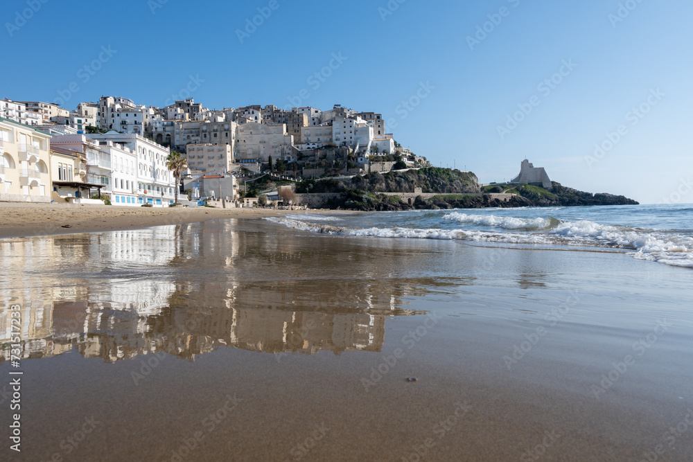 View on sandy beach and sea water in medieval small touristic coastal town Sperlonga and sea shore, Latina, Italy