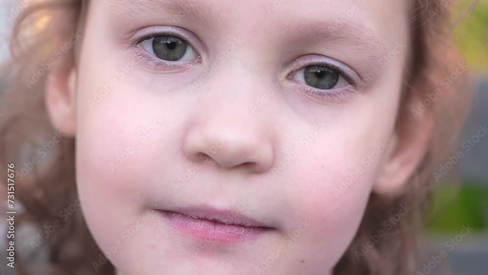 fair-haired curly girl looking into the camera fair-haired curly girl looking into the camera