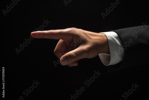 Businessman in suit pointing with hand, conveying success and agreement gesture