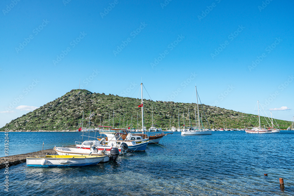 The scenic views from Gümüşlük bay with yachts in Bodrum, Turkey