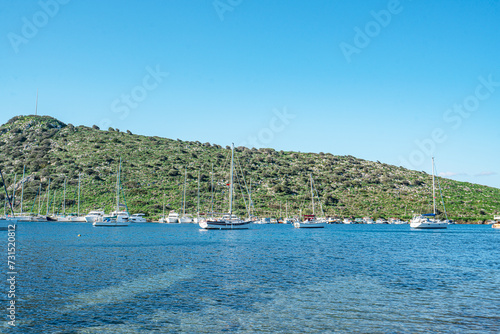 The scenic views from Gümüşlük bay with yachts in Bodrum, Turkey photo