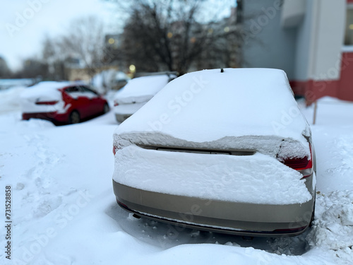Car covered with white snow