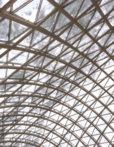 A glass roof in a building covered with snow as an abstract background. Texture