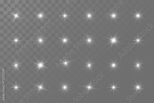 Set of glowing stars. Glare light effect. On a transparent background.