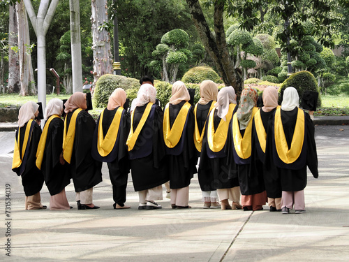 Photography Dark-faced students pose for a photo in a park in Kuala Lumpur, Malaysia