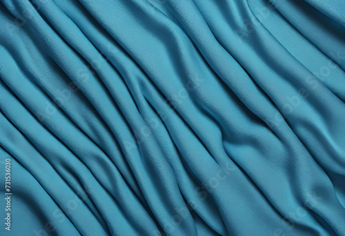 Abstract smooth elegant blue fabric silk texture soft background  flowing satin waves.