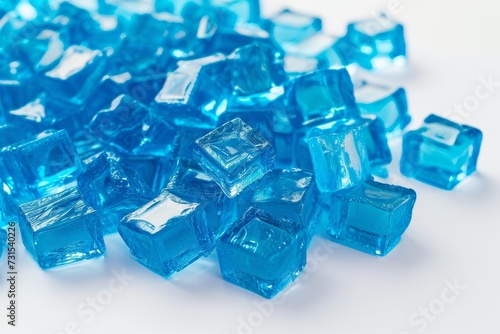 Pile of blue jelly blocks on white backdrop