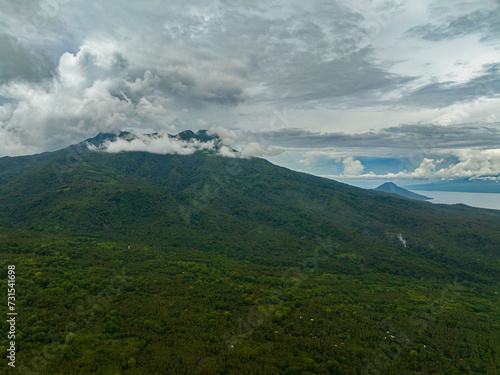 Tropial landscape of mountain hills and forest with clouds and fog. Camiguin Island. Philippines.