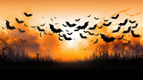 A Group of Bats Flying Over a Field