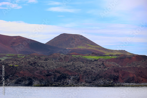 View of the Eldfell Volcano and Helgafell high cinder cone on the island of Heimaey off the south coast of Iceland  