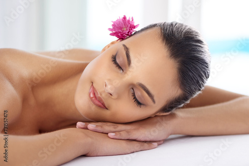 Woman, massage and organic treatment at salon, wellness and beauty therapy for body care. Female person, relaxing and serene or dermatology, cosmetics and resting at resort hotel and peace or zen