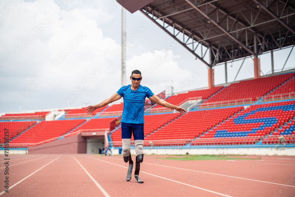 Obraz premium Asian para-athlete with prosthetic blades warms up body in the stadium. 