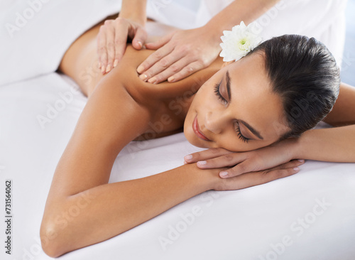 Woman, back massage and body treatment for healing, wellness and muscle therapy for bodycare. Female person, masseuse and health by dermatology, calm and resting at resort hotel and peace or zen