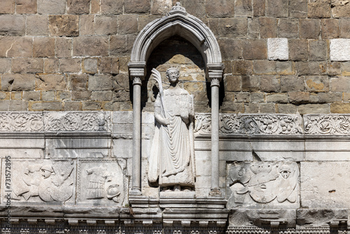 Statue of Saint Justus on facade of Trieste Cathedral, Trieste, Italy photo