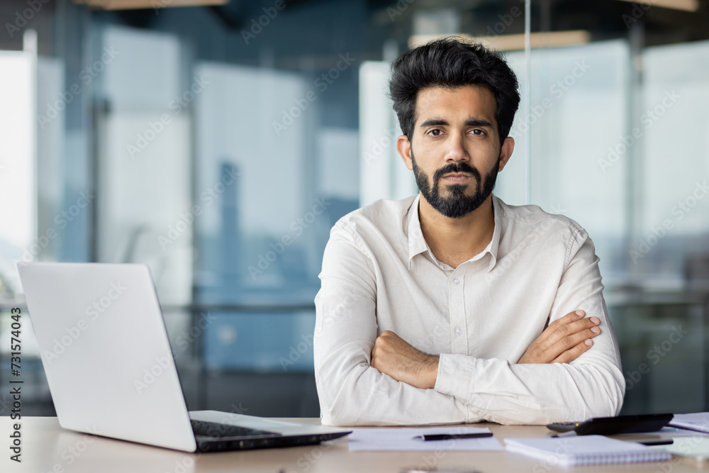 An engineering event with a bearded man on laptop at desk An engineering event with a bearded man on laptop at desk