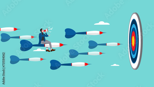 business or marketing target strategy, aim the target audience, introduce products or promotions to the right target audience, businessman control dart with megaphone to reach perfect target