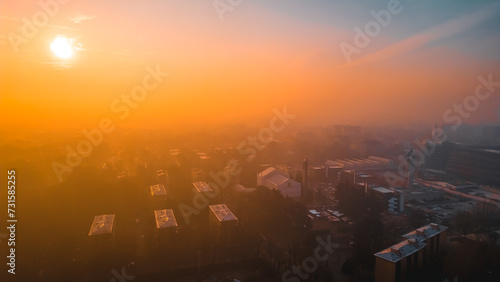 Dawn and fog over the city as seen from a drone. Lombardia, Milano, Italia