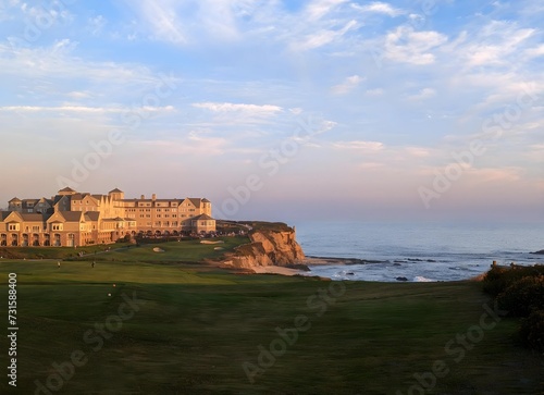 grand palace overlooking rugged cliffs at sunset
