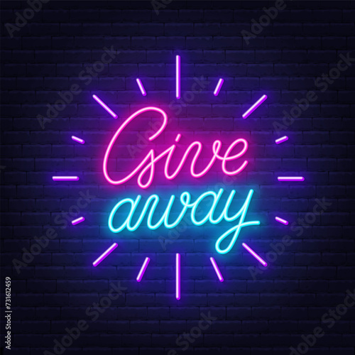Giveaway neon sign on brick wall background.