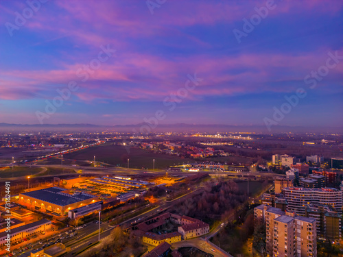 City in Italy with beautiful Sunset . Cityscape from drone. Italy, Lombardy, Milan, San Donato Milanese