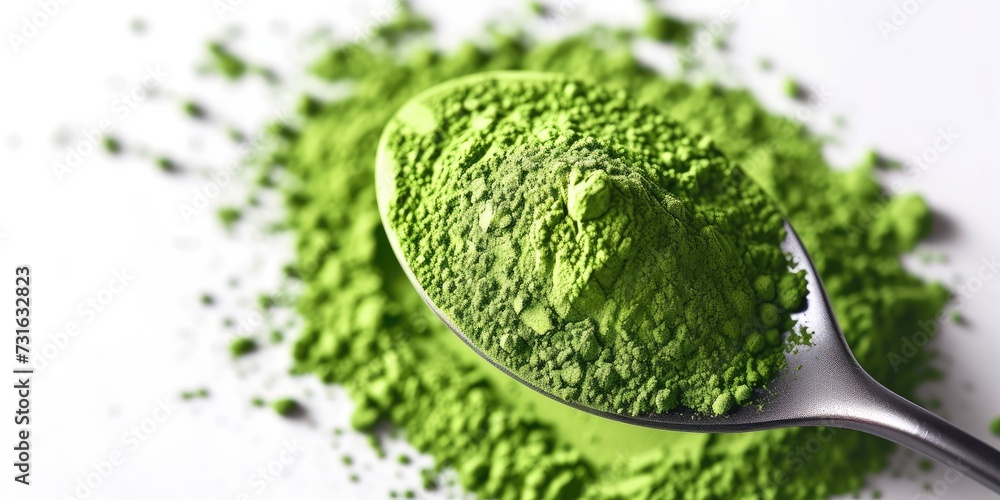 Obraz premium a spoon covered with powdered matcha powder, prepare Japanese green Matcha tea