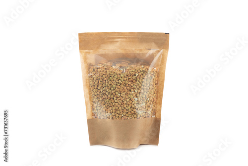 Green buckwheat in a bag isolated on a white background. Superfood. Raw buckwheat porridge. Healthy vegan food, eco products, diet, organic.